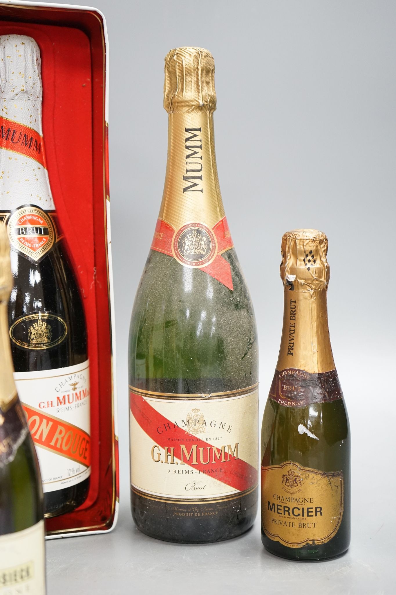 Two bottles of Mumm champagne and two small bottles of champagne